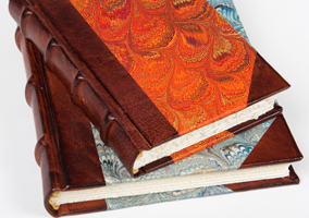 Leather and paper boung mixed journals.